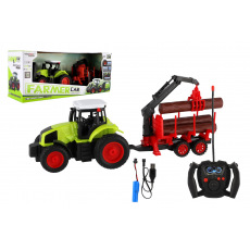 Traktor RC s vlekem na dřevo plast 38cm 27MHz + dobíjecí pack na baterie v krabici 45x18x13cm
